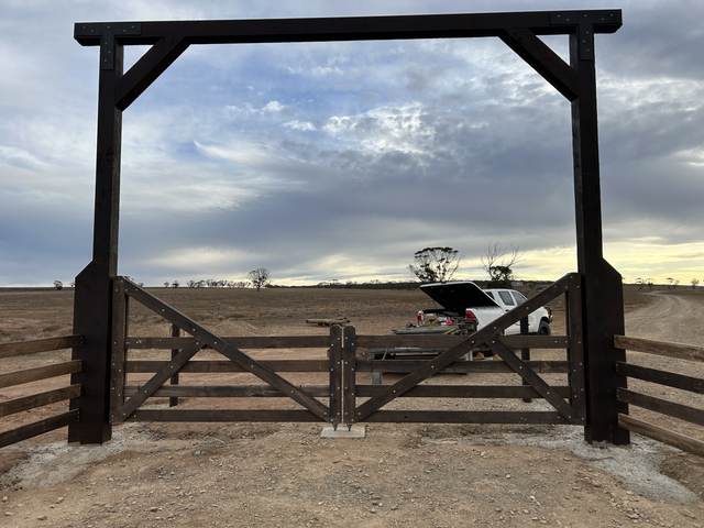 Overhead entrance frame, black-stained timber