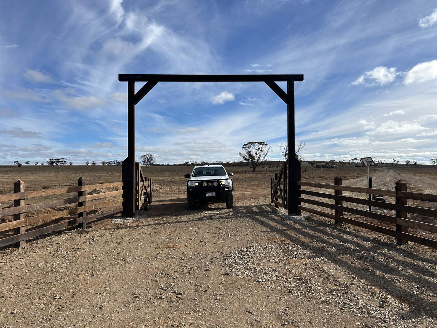 Entrance frame and gates at a farm driveway