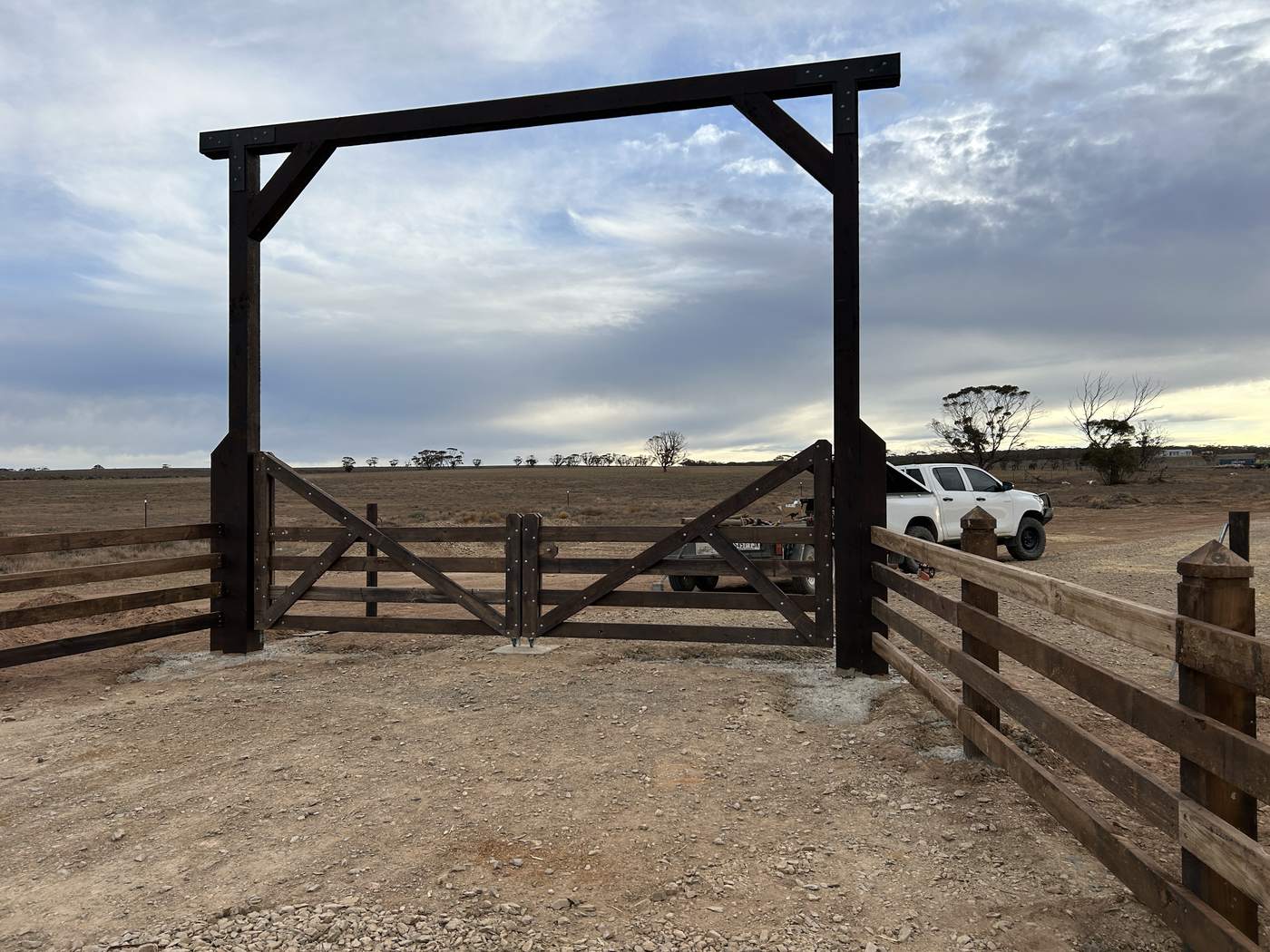 Overhead timber entrance frame over double farm gates