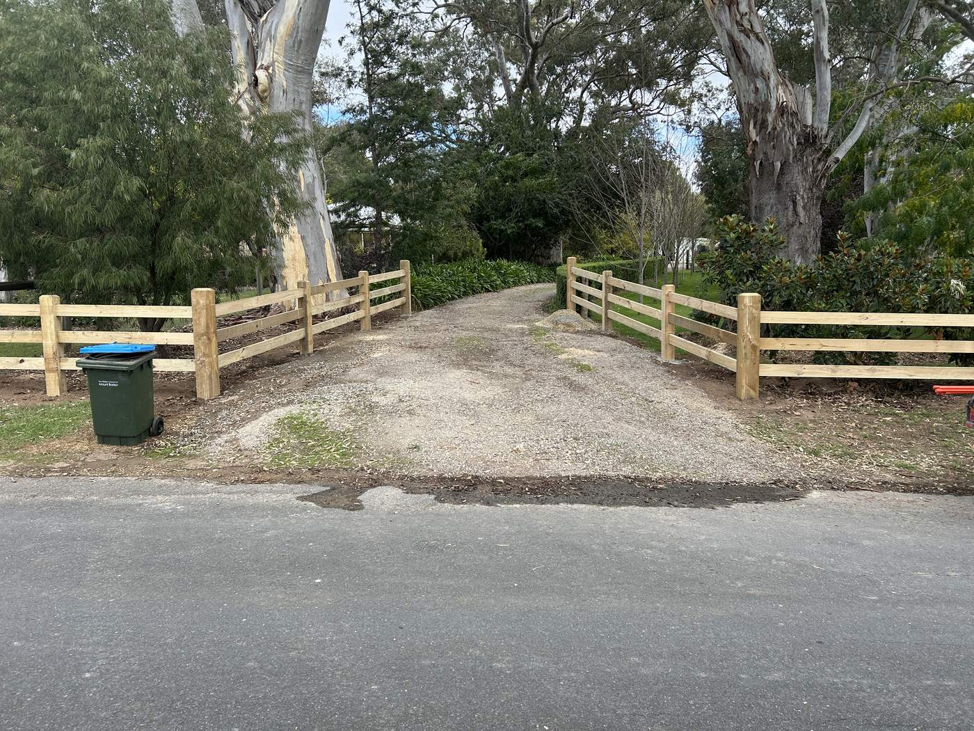 Post and rail either side of a driveway