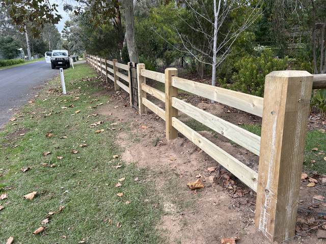 Roadside post and rail fence